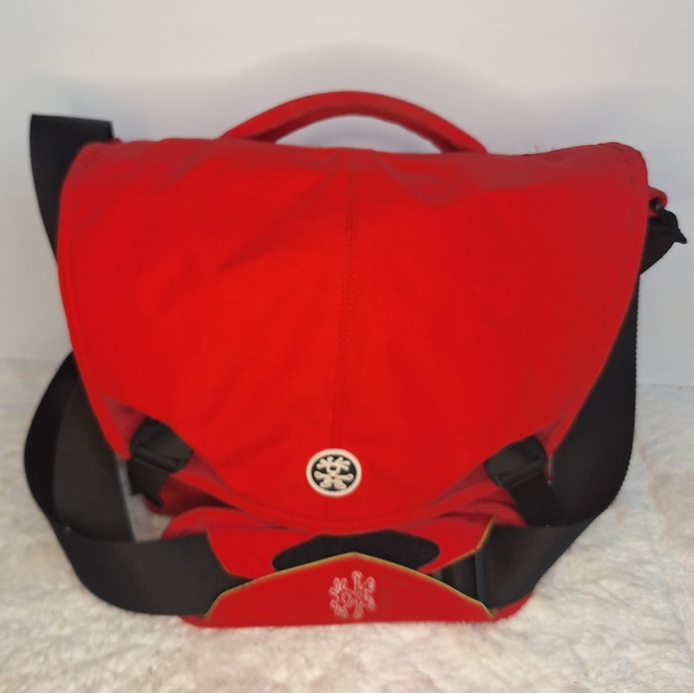 Red and Black Crumpler 6 million dollar home Camera Bag.